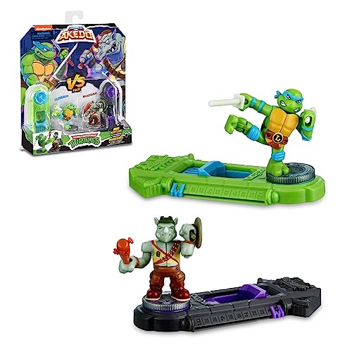 Akedo - Versus Pack Ninja Turtles mit Leonardo vs Mutante Rocksteady, Arcade-Puppen, 2 Figuren und 2 Kampfsteuerungen, Sammelspielzeug, 4 Jahre, Berühmt (AKT00100) von Akedo