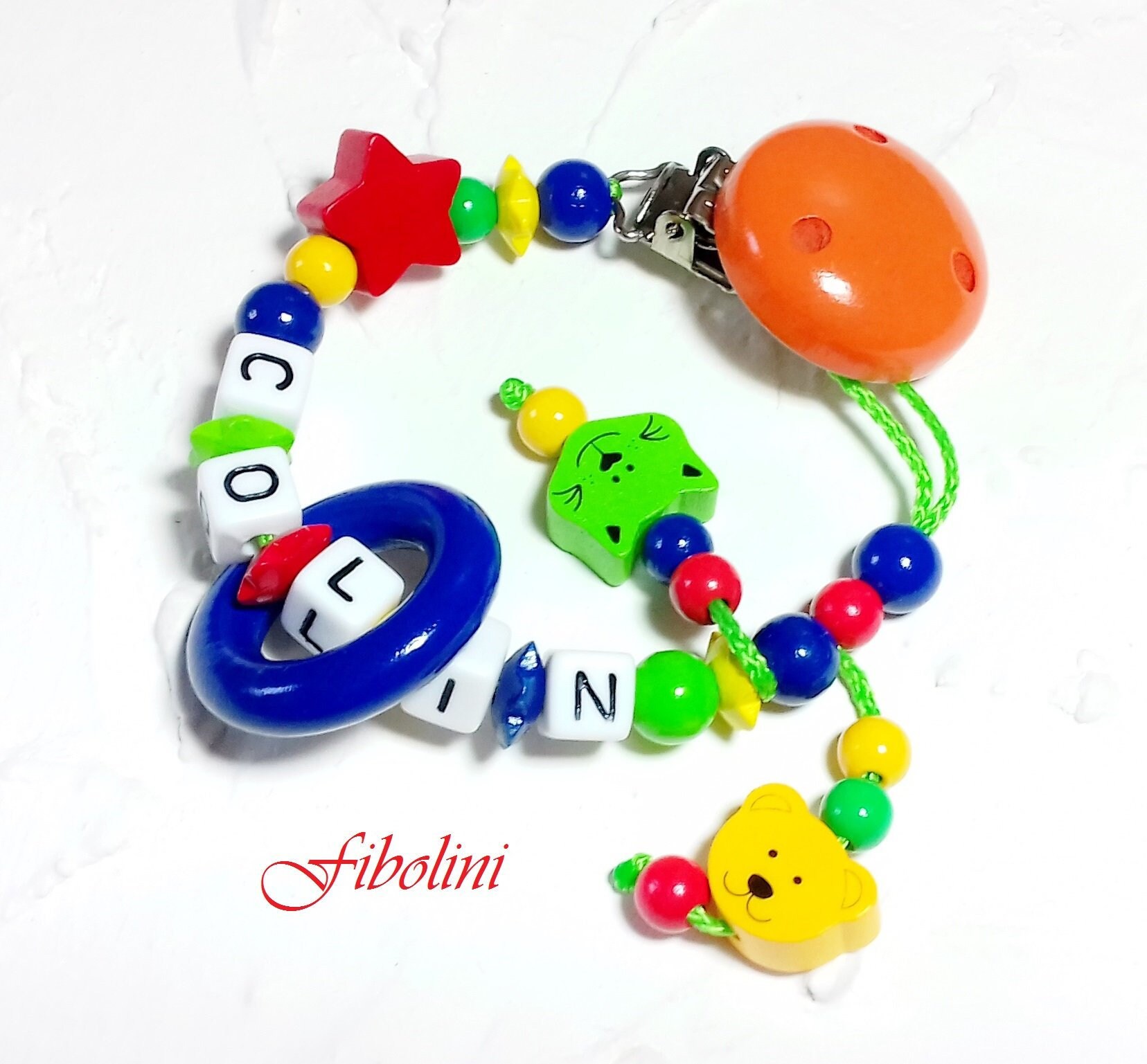 Schnullerkette "Farbenfroh". Blau, Grün, Gelb, Rot, Orange, Nuckelkette, Schnuller, Schnullerhalter, Personalisiert, Junge, Mädchen, Namen Schnullerkette "Farbenfroh". Blau, Grün, Gelb, Rot, Orange, Nuckelkette, Schnuller, Schnullerhalter, Personalisiert, Junge, Mädchen, Namen von Etsy - Fibolini