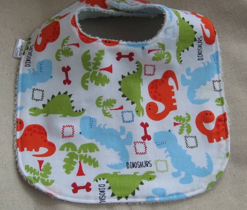 Baby Junge Lätzchen - Dinosaurier in Orange, Blau Und Grün von Etsy - MoonGardenDesign