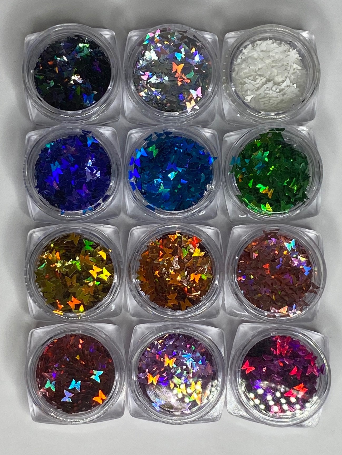 12 Packung Schmetterling Glitter Nail Flakes, Laser Pailletten, Regenbogen Schmetterlinge, Nagellack, Uv Gel/Harz Craft Pailletten 12 Packung Schmetterling Glitter Nail Flakes, Laser Pailletten, Regenbogen Schmetterlinge, Nagellack, Uv Gel/Harz Craft Pailletten von Etsy - NailditbyTara
