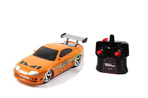 Jada Toys Fast & Furious RC Auto Brian's Toyota Supra, Ferngesteuertes Auto mit 2 Kanal Funksteuerung, Turbofunktion, fährt vorwärts rückwärts, Links rechts, Maßstab 1:24, ab 6 Jahren, orange von Jada