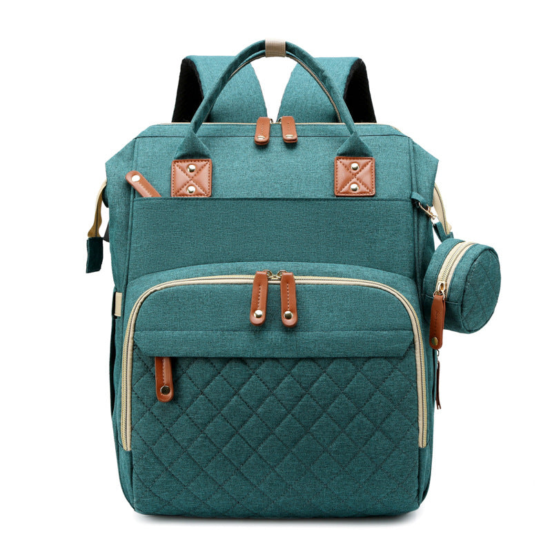 TravelNest– Immer ein Ort der Ruhe – 2-in-1-Wickeltasche mit Babybett Grün | Pädagogisches Holzspielzeug von Mein Kleines Baby