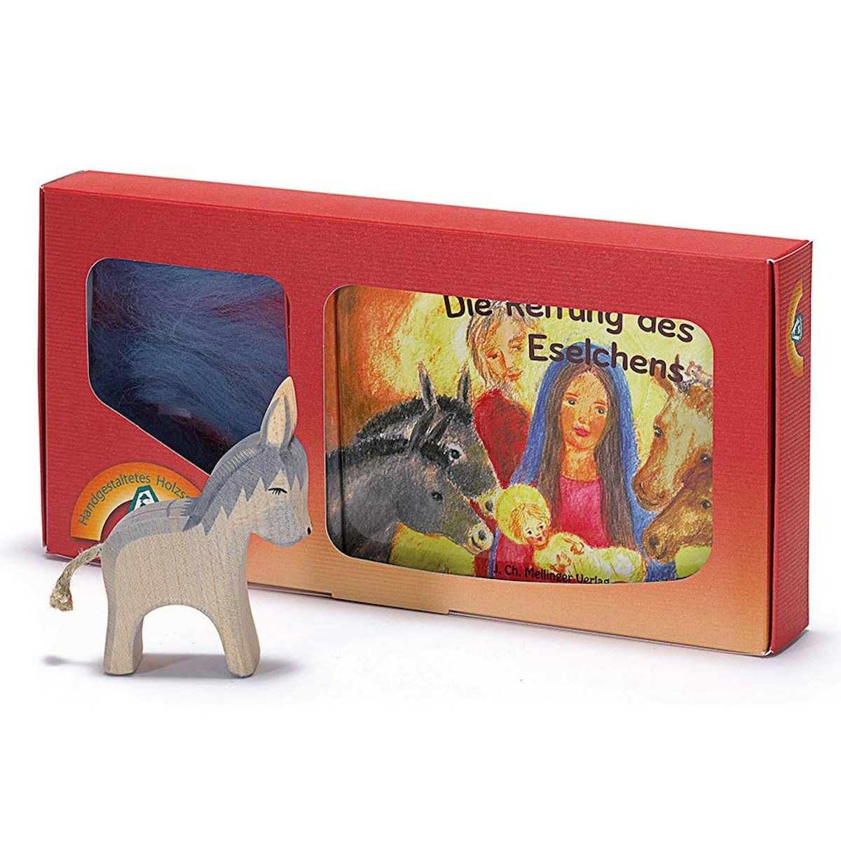 Esel und Buch mit Holzfigur